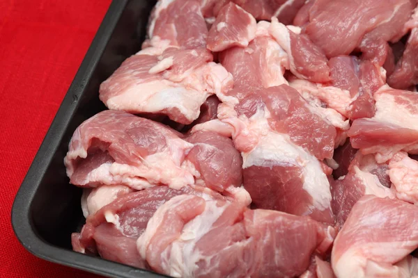 Fresh pork meat in a roasting pan — Stock Photo, Image