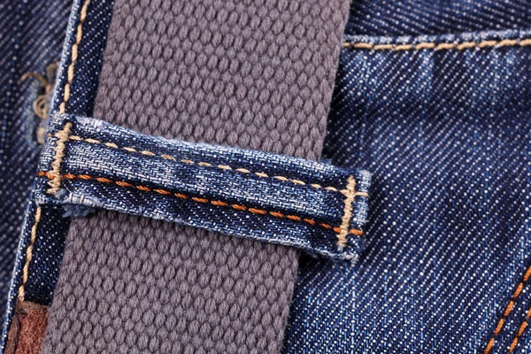 Close-up of blue jeans with belt — Stock Photo, Image