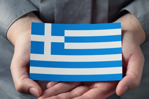 Grecka flaga w dłonie — Zdjęcie stockowe