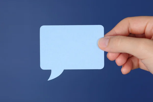 Hand holds speech bubble — Stock Photo, Image