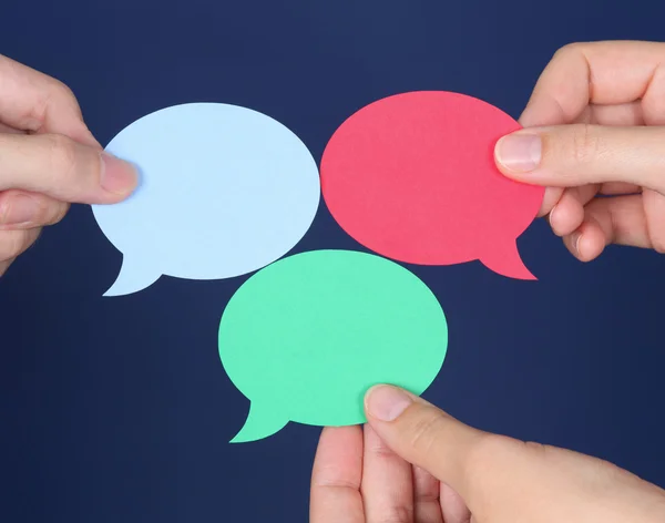 Hands holds blank colorful speech bubble — Stock Photo, Image