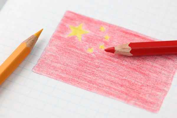 Čínská vlajka tužkou uvnitř notebooku — Stock fotografie