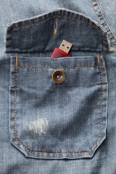 USB flash drive in the denim shirt pocket — Stock Photo, Image