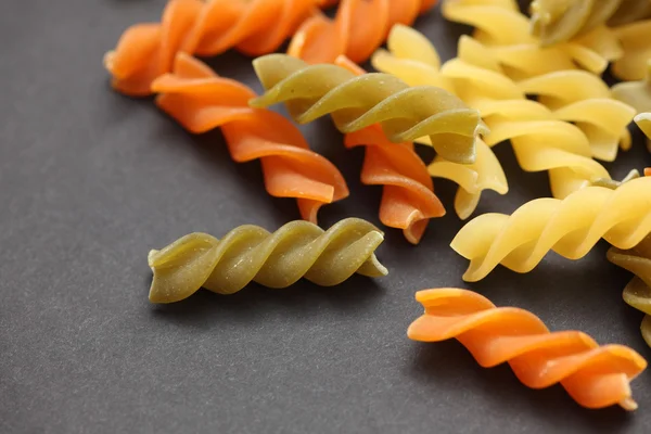 Raw colorful fusilli pasta — Stock Photo, Image