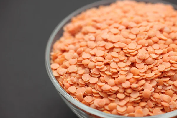 Red lentils in a glass bowl — Stock Photo, Image