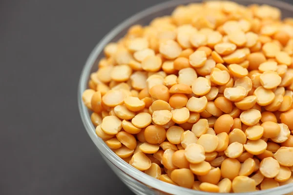 Split yellow peas in a glass bowl — Stock Photo, Image