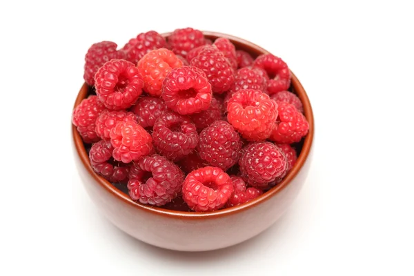 Red raspberries in bowl — Stock Photo, Image