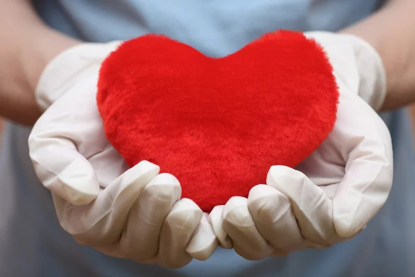 Heart shape in doctor's hand — Stock Photo, Image