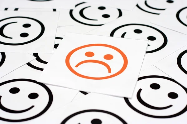 Sad face and happy faces — Stock Photo, Image