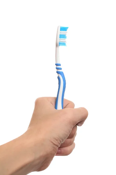 Cepillo de dientes en la mano —  Fotos de Stock