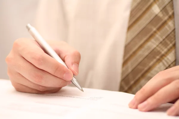 Businessman viewing the contract before signing — Stock Photo, Image