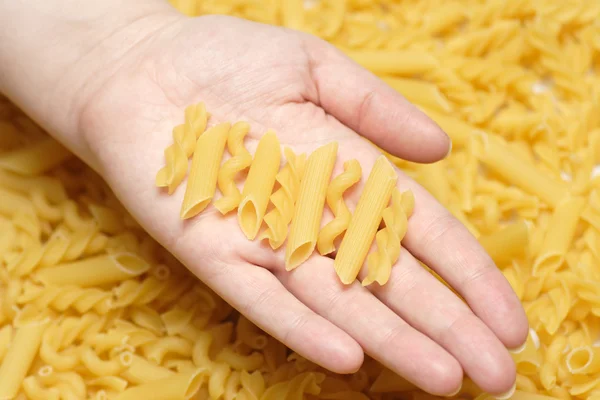 Pasta in hand — Stock Photo, Image