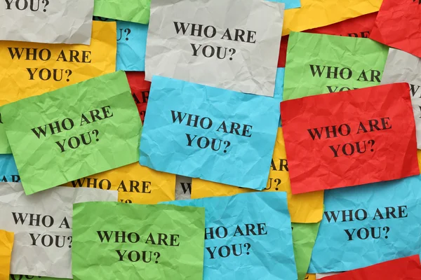 Crumpled colorful paper notes with the question "Who are you?" — Stock Photo, Image