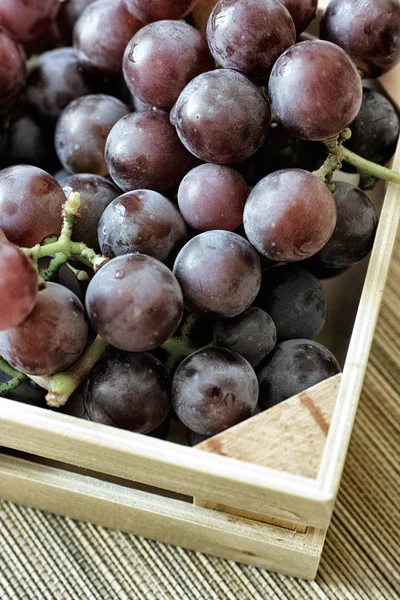 Red grapes bunch into box — Stock Photo, Image