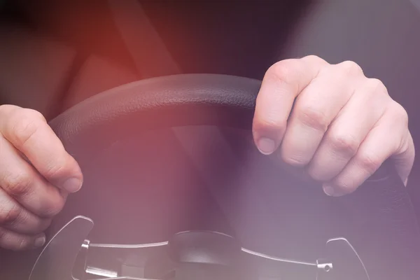 Woman hands on steering wheel of a car — Stock Photo, Image