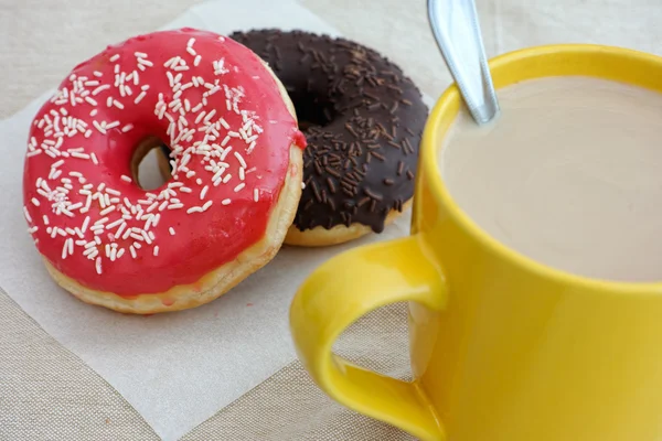 Donuts and coffee cup with milk — Stock Photo, Image