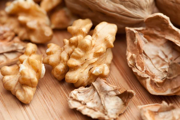 Walnuts on wooden background — Stock Photo, Image