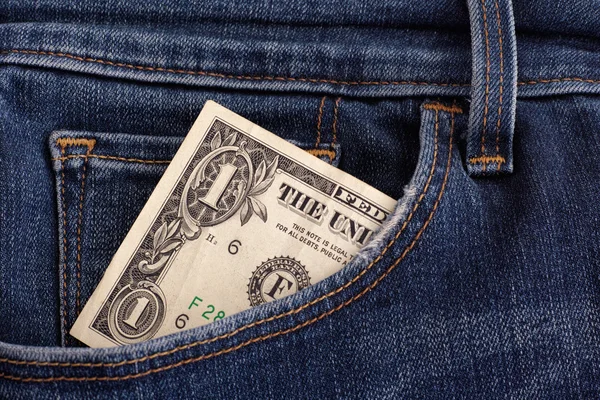 One dollar bill in a pocket of blue jeans — Stock Photo, Image