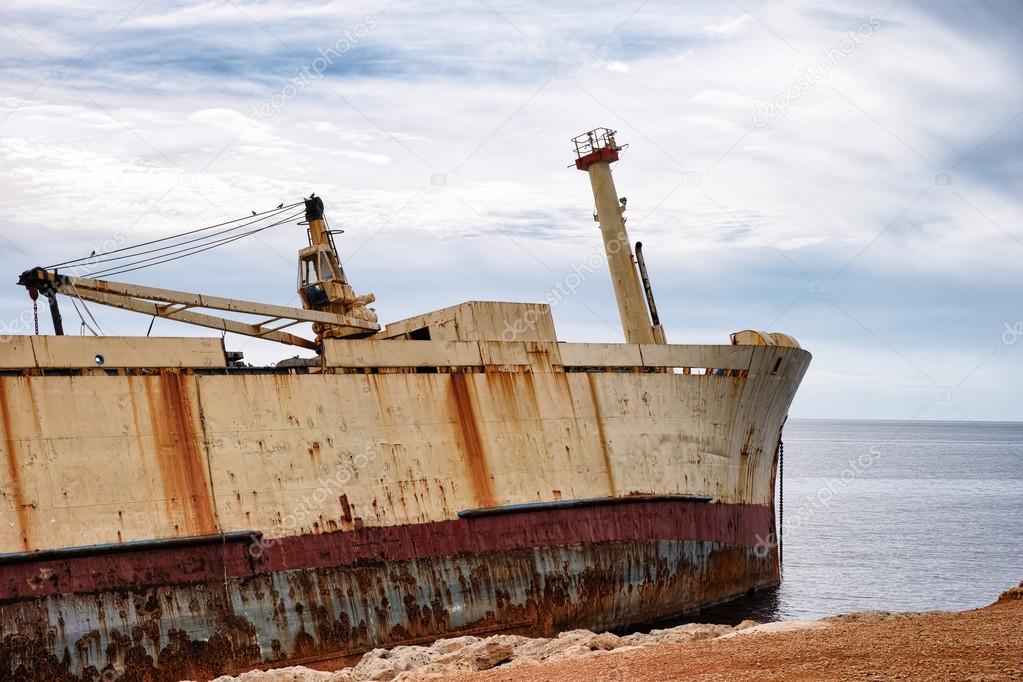 Abandoned wreck old ship near shore