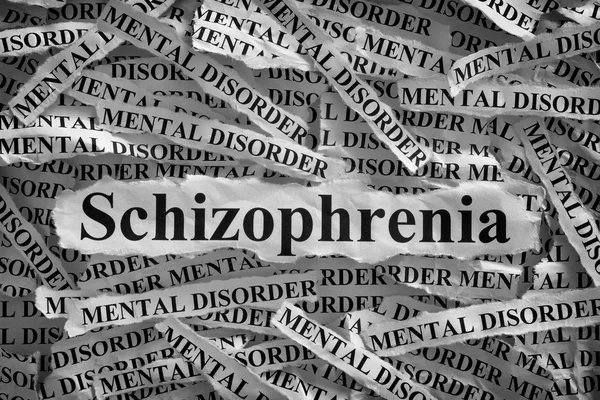 Schizofrenii. Poszarpane kawałki papieru z napisem schizofrenii i zaburzeń psychicznych — Zdjęcie stockowe