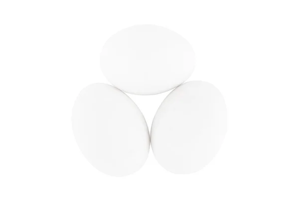 Drie witte eieren geïsoleerd op witte achtergrond — Stockfoto