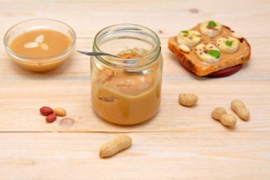 open jar of peanut butter for making toast