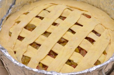 rhubarb pie dough in a baking dish, cooking phase