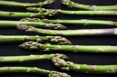 green asparagus on a dark background low key