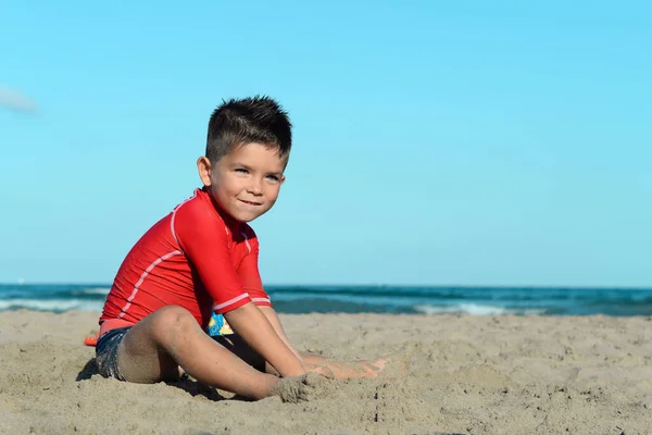 Childrens games by the sea in hot summer