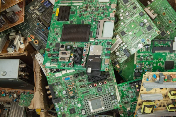 A box of broken LCD TV motherboards. Electronic equipment repair shop