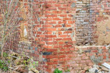 The remains of an old abandoned red brick building