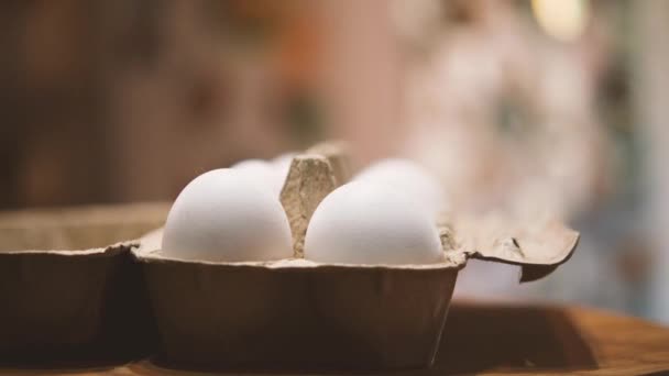Close Carton Ten White Eggs Background Kitchen Interior Camera Flies — Stock Video