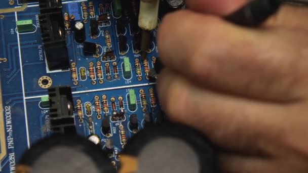 Repairman Uses Tester Check Pins Blue Motherboard Repair Shop Electronics — Stock Video