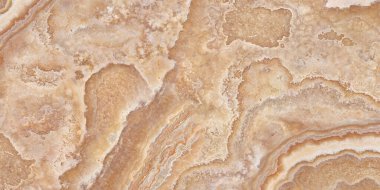 Dalgalı damarları olan mermer texstur bej rengi.
