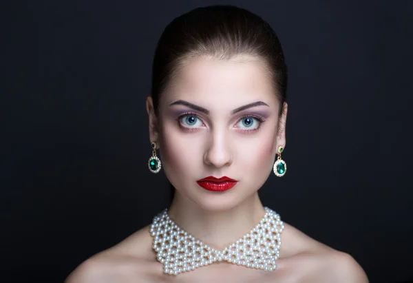 Woman with white necklace — Zdjęcie stockowe