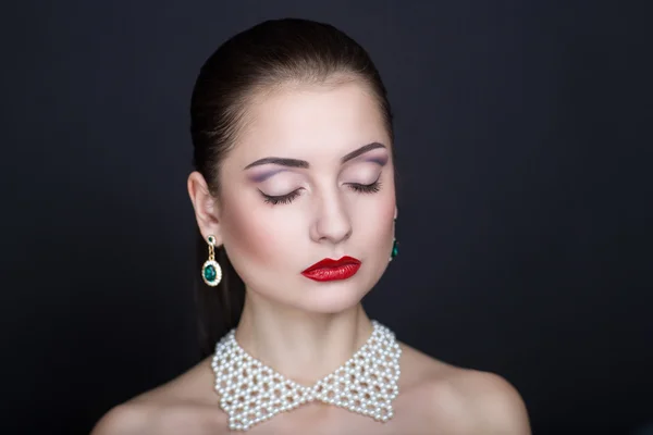 Woman with white necklace — Stock fotografie