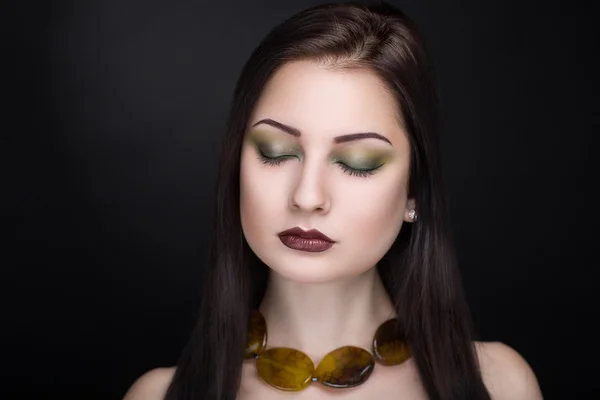 Woman with brown necklace — Stock fotografie