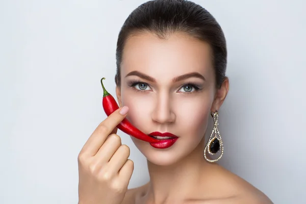 Woman with chili peper — Stok fotoğraf