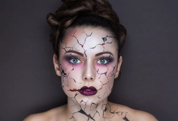 Cracks on face — Stockfoto