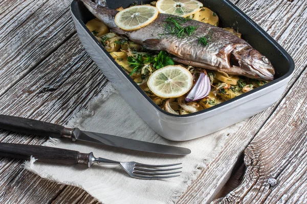 stock image Baked trout with potatoes.