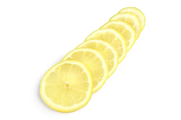 Lemon slices in row over white background — Stock Photo, Image