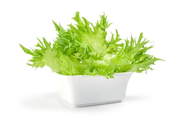 Fresh lettuce leaves in bowl on a white background — Stock Photo, Image