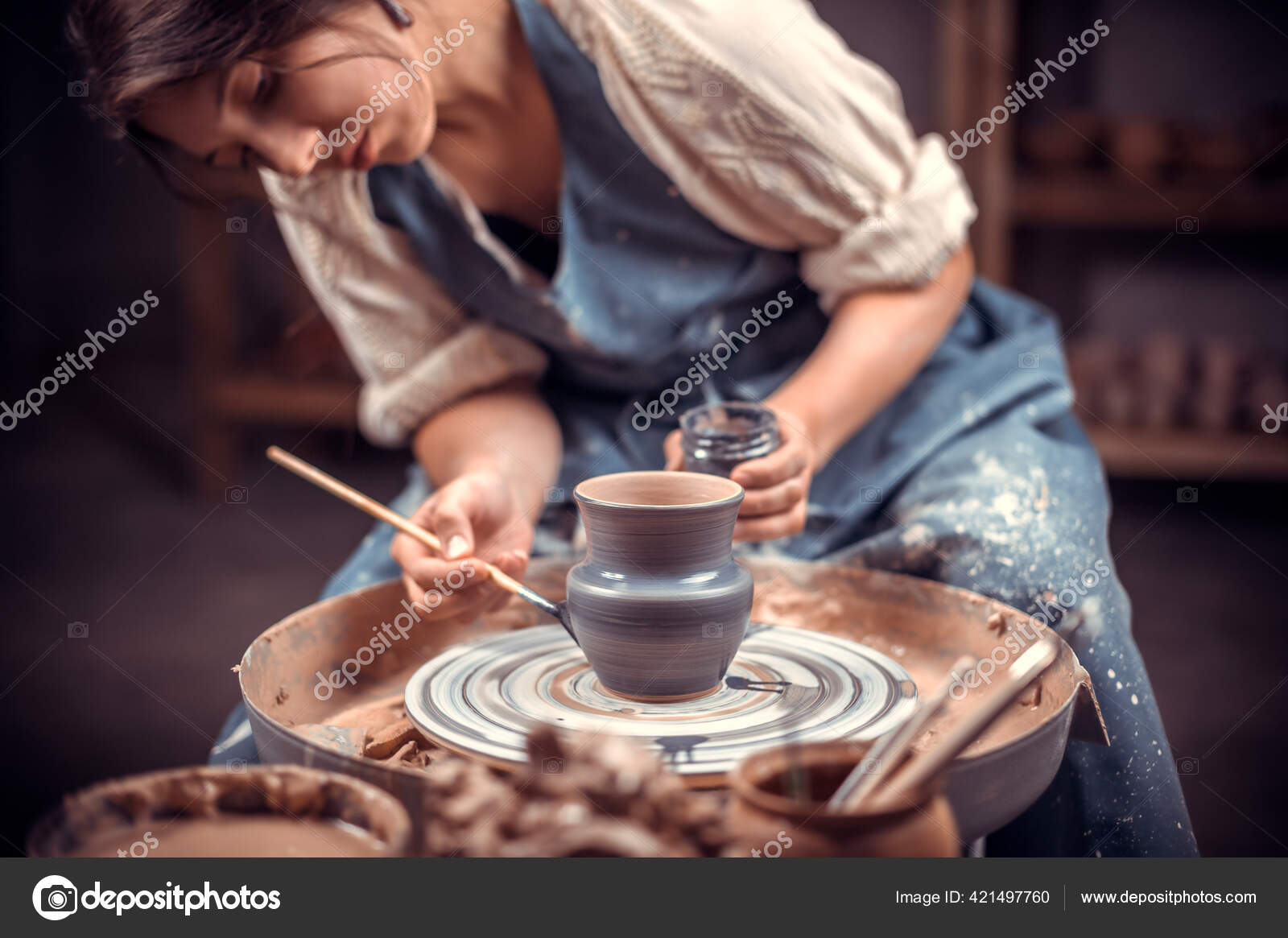 Stylish pottery molding a vase of clay on a potters wheel. Handmade. Stock  Photo by ©Stop war in Ukraine! 421497760