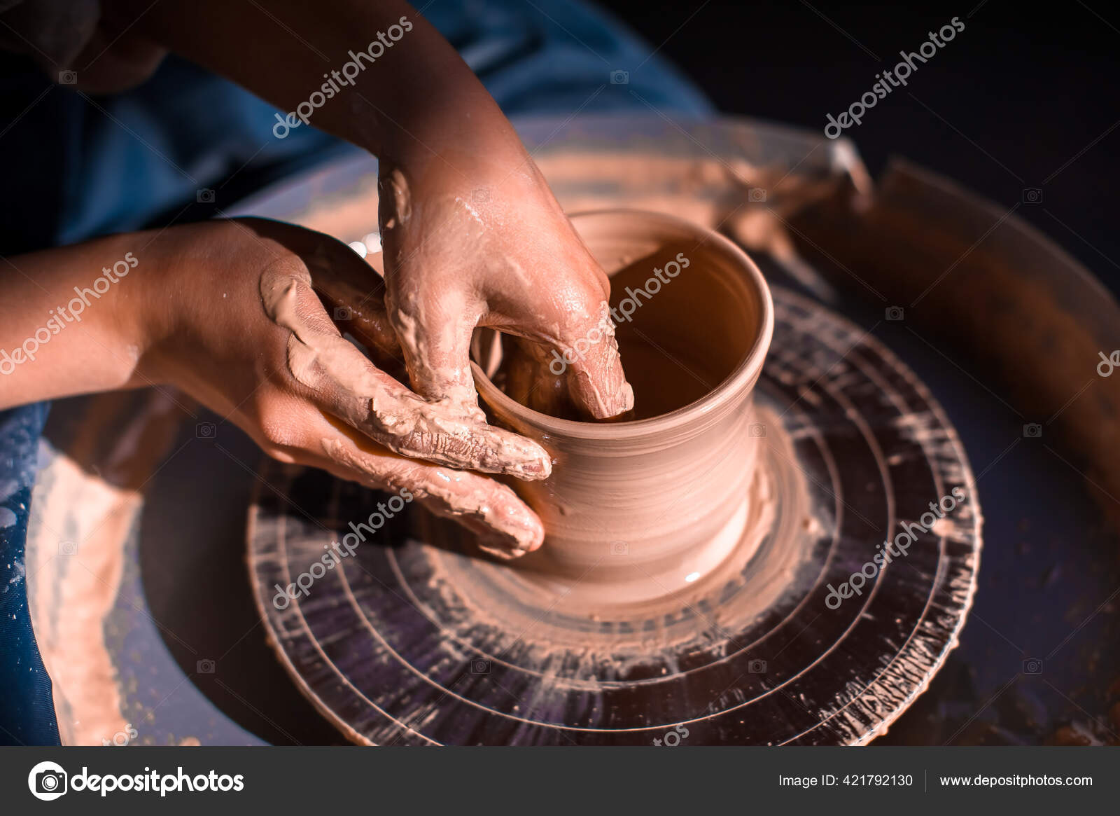 Pottery girl sculpts from clay. Handmade products. Closeup. Stock Photo by ©Stop war in Ukraine