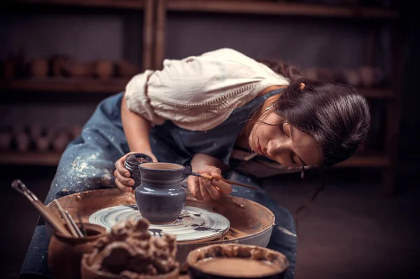 Stylish pottery molding a vase of clay on a potters wheel. Handmade. Stock  Photo by ©Stop war in Ukraine! 421497760