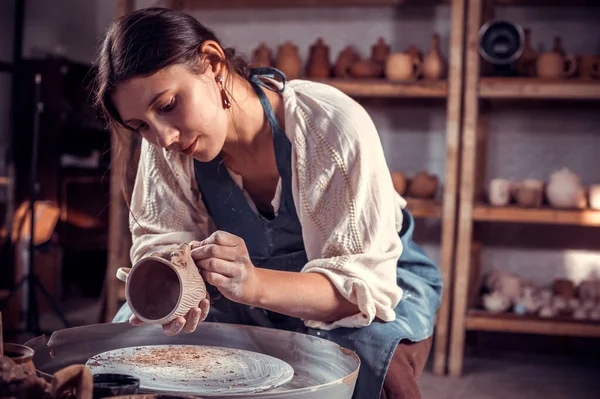 Charming ceramist sculpts from clay. Artisan production. — Stock Photo, Image