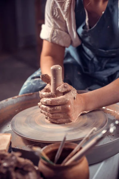 Professional potter is working on pottery wheel. Craft manufacture. Close-up. — Stock Photo, Image