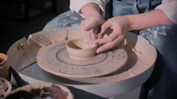 Ceramist woman making ceramic pot on the pottery wheel . Inspiration and creativity. Close-up. — Stock Video