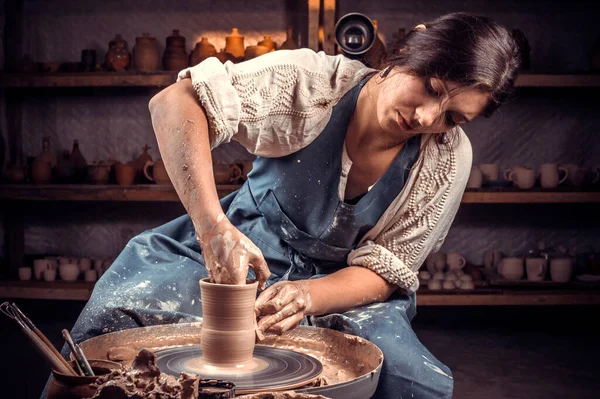 Charming professional potter molding a vase of clay on a potters wheel. Hand work. — Stock Photo, Image