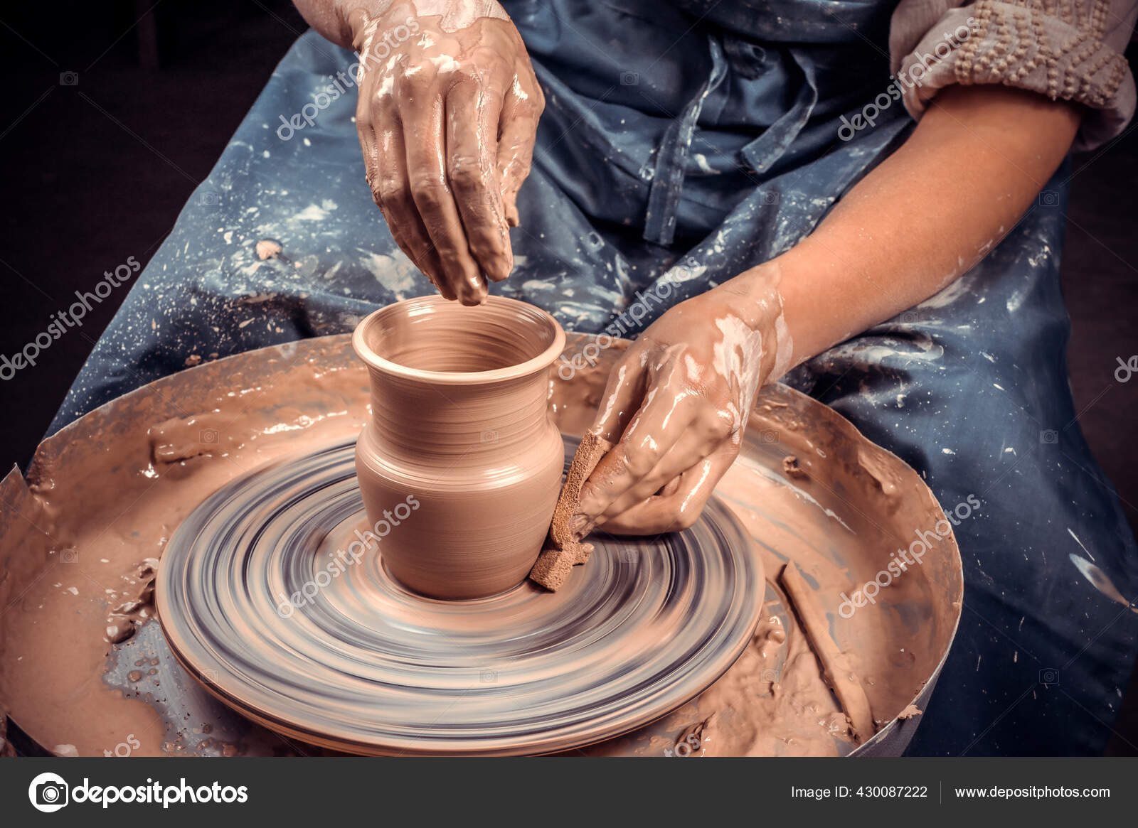 Potter Hands Making In Clay On Pottery Wheel. Potter Makes A